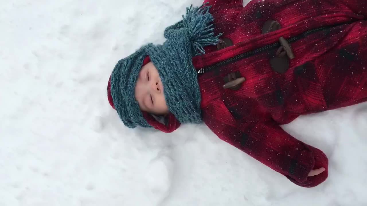 Baby's First Snow Experience Is Beyond Precious