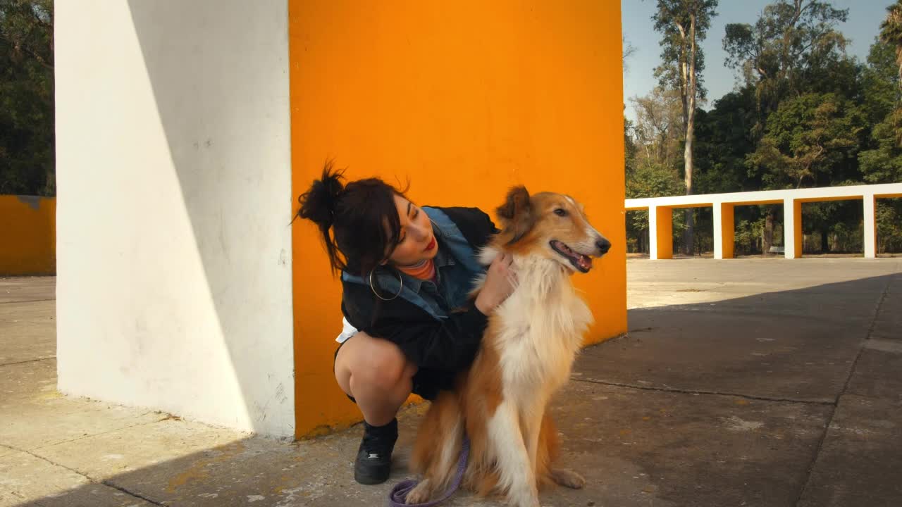 A woman hugging a dog