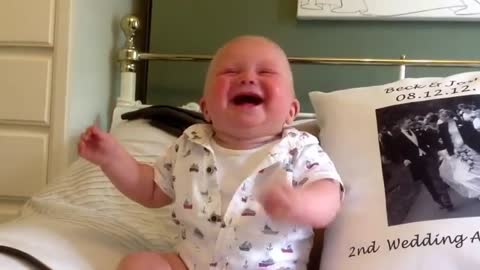 Baby laughing and enjoying with dad
