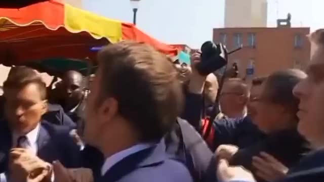 Macron pelted with tomatoes near Paris