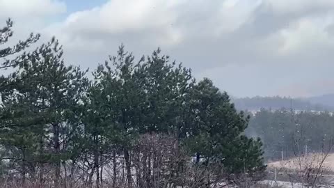 windy and snowy in the mountains.