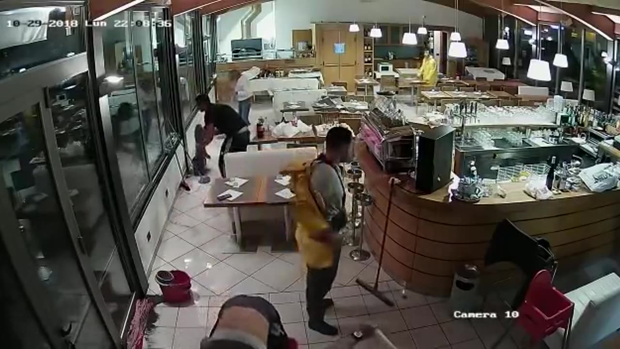 Wave Crashes Through Windows of Italian Restaurant