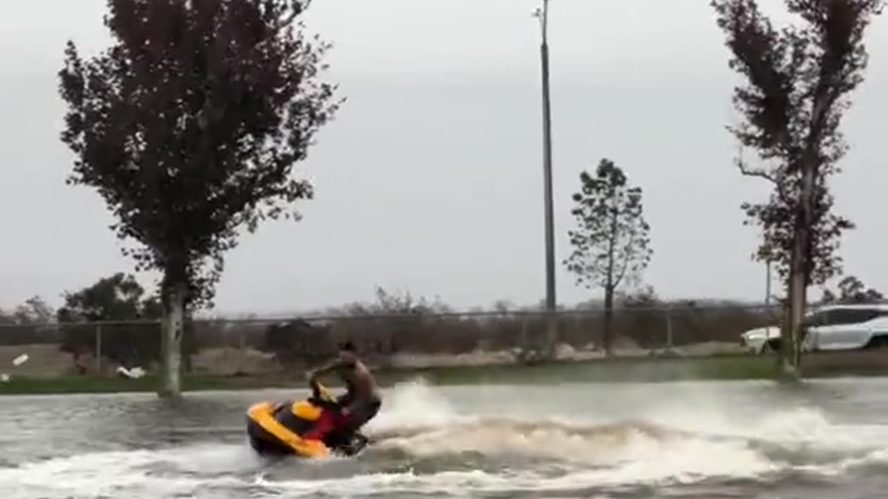 California man jet skis thru neighborhood during Hurricane Hillary