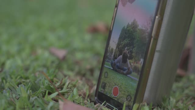 Smartphone camera recording a yoga practice