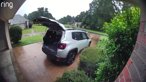 Woman Runs Into Garage Door While Trying to Protect Hair