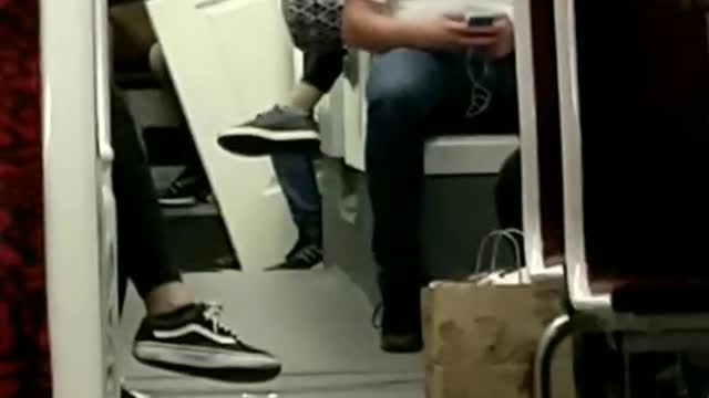 Guy brings white door onto subway train