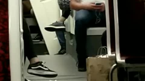 Guy brings white door onto subway train