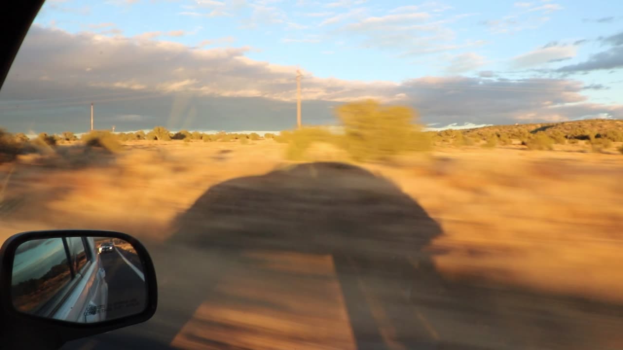 Driving towards the Grand Canyon - Being followed by my shadow