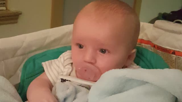 3 month old working to put pacifier back in his mouth too cute