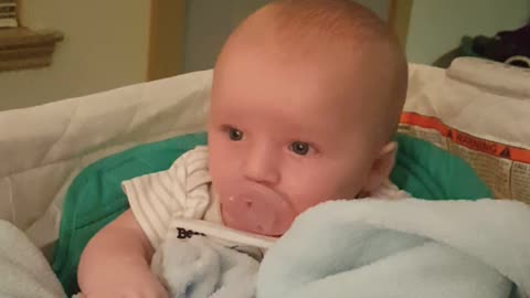 3 month old working to put pacifier back in his mouth too cute