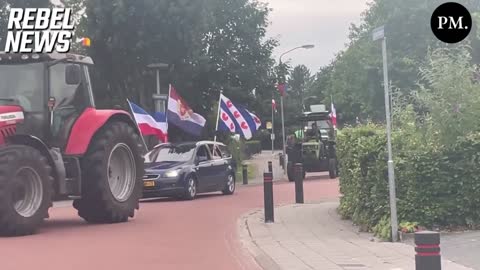 Coming Through! Dutch Farmers Roll Through the Town of Marum