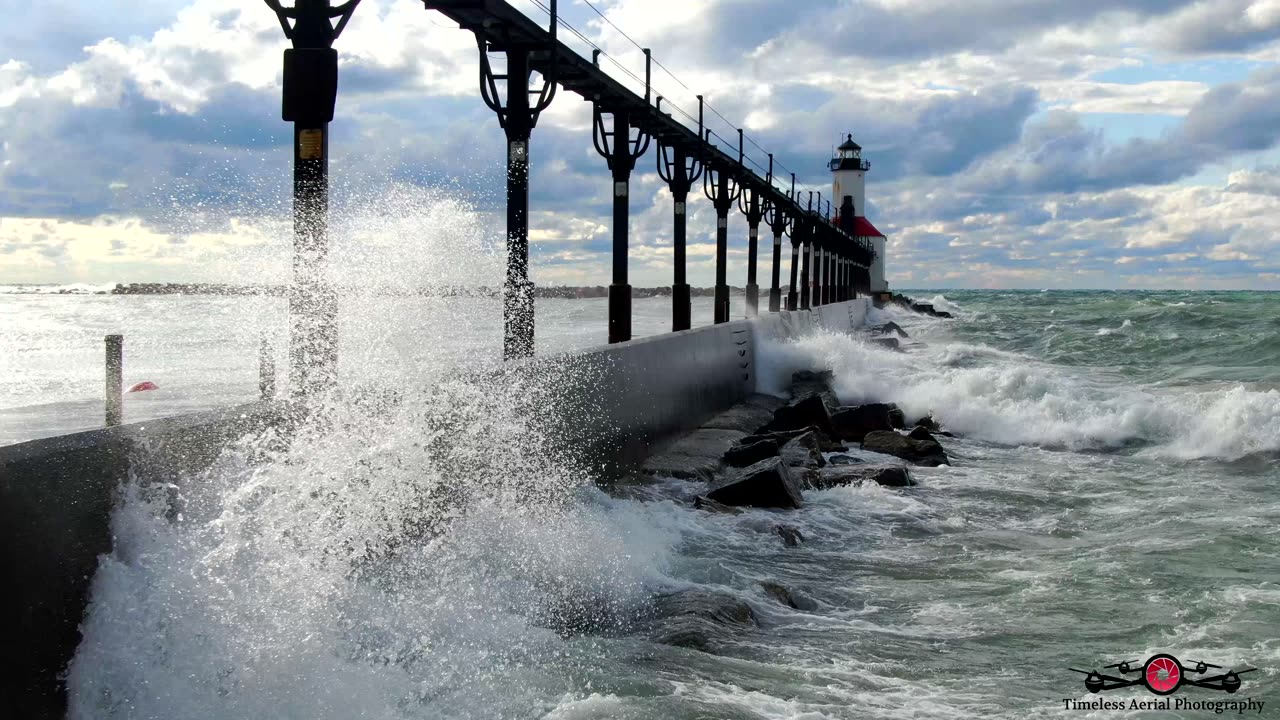 Stunning Waves Washing Over The Lighthouse Pier 4K Drone Footage