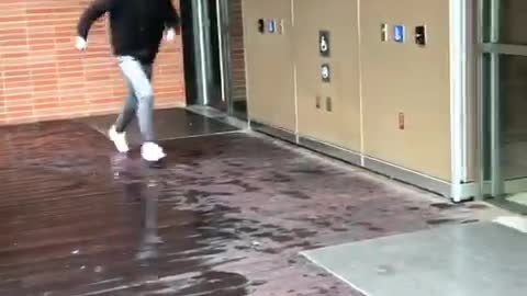 White hat tries to slide across metal gets hit by opening door