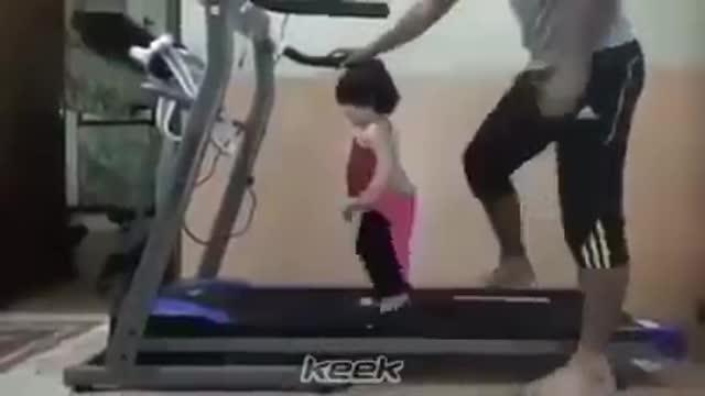 Little cute baby goes for a workout with daddy