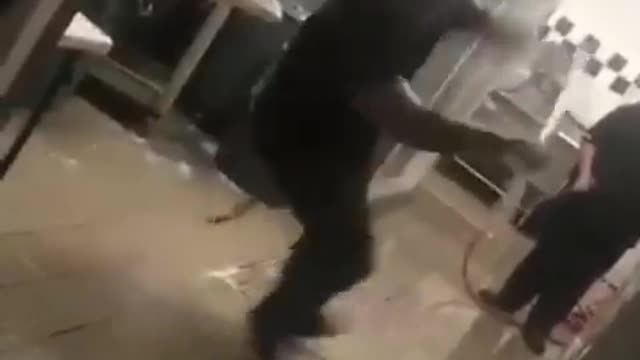 young woman gets excited about cleaning the floor, and ends up falling.