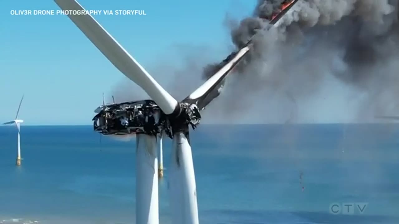 Wind turbine catches fire off the coast of England.mp4