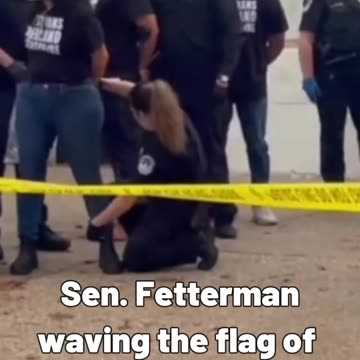 Sen. Fetterman waving the flag of Israel to jeers