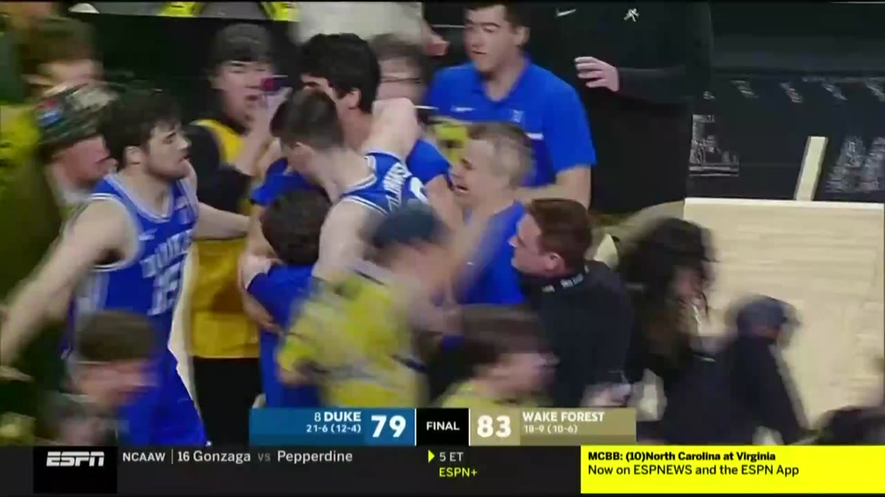 Duke basketball player Kyle Filipowski (#30), injured after Wake Forest fans storm court