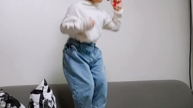 4 year old baby jumping on the sofa
