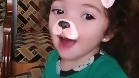 A beautiful baby with a dog filter