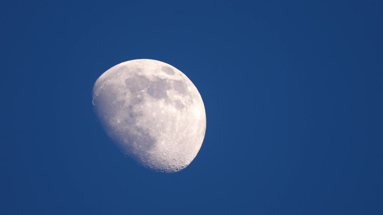 Half moon in the blue sky