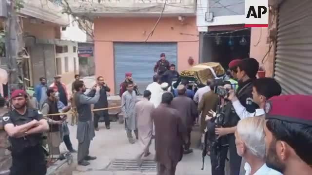 Police react after Peshawar suicide bomber kills over 50