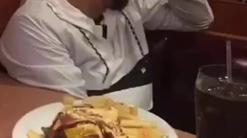 Friend throws bun at friends face