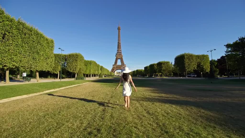 A rare moment of quiet under the Eiffel Tower in the early morning