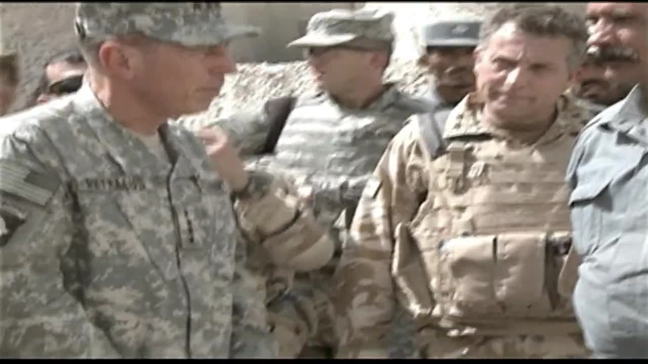 Gen. David Petraeus visiting with U.S. and Afghan service members and officials in Afghanistan.