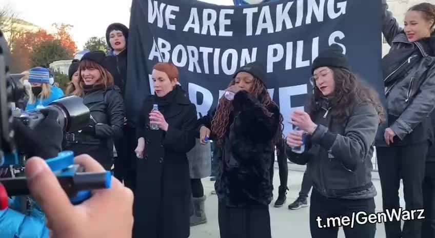 Pro-Abortion Activists Take Abortion Pills Outside Supreme Court