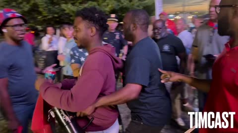 🚨A black Trump supporter (in the Harvard hoodie) is physically confronted by Haitians for Harris