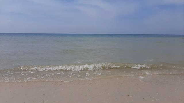 The sea and the sound of the surf on a sunny day