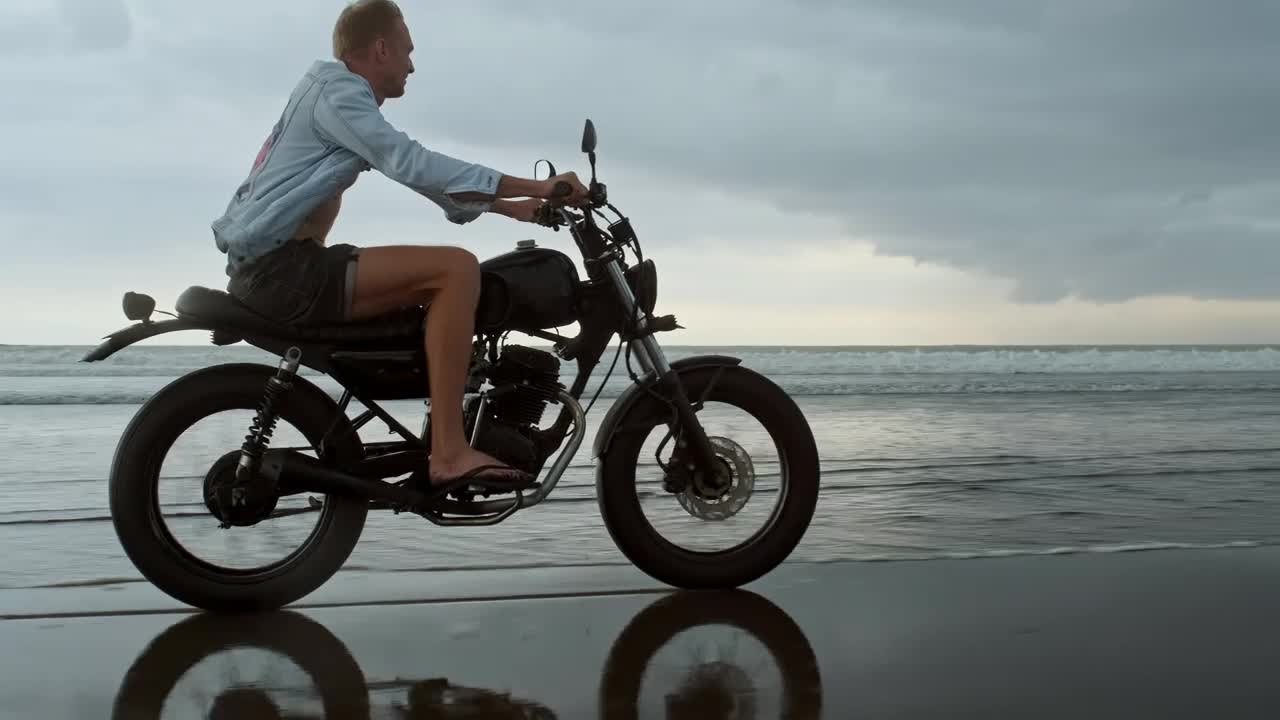 Biker riding on the beach