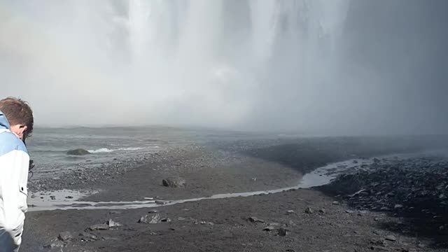 Dominik surfing waterfall in iceland