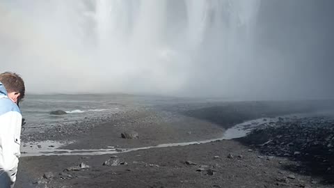 Dominik surfing waterfall in iceland