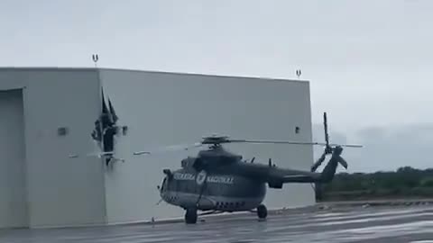 Mexican National Guard Mi-17 helicopter damaging a hangar with its rotor blades