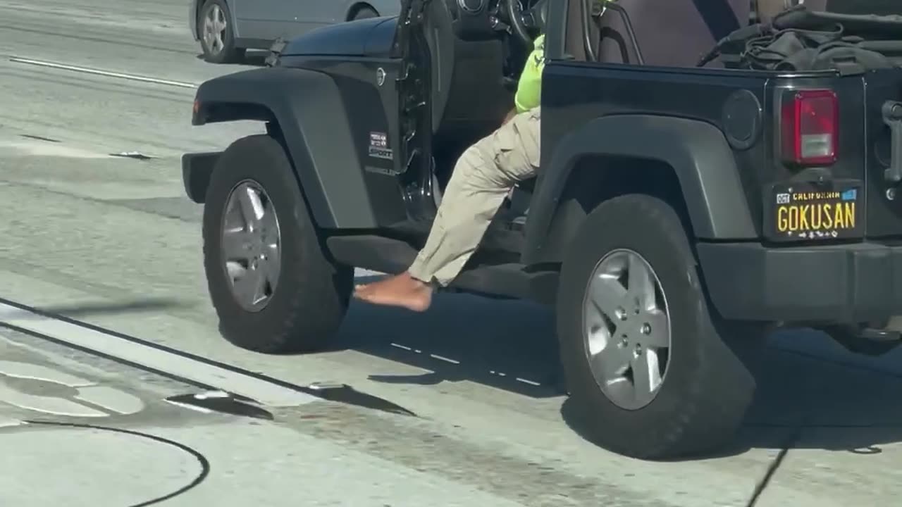 Driver Lets His Foot Hang Loose on the Highway