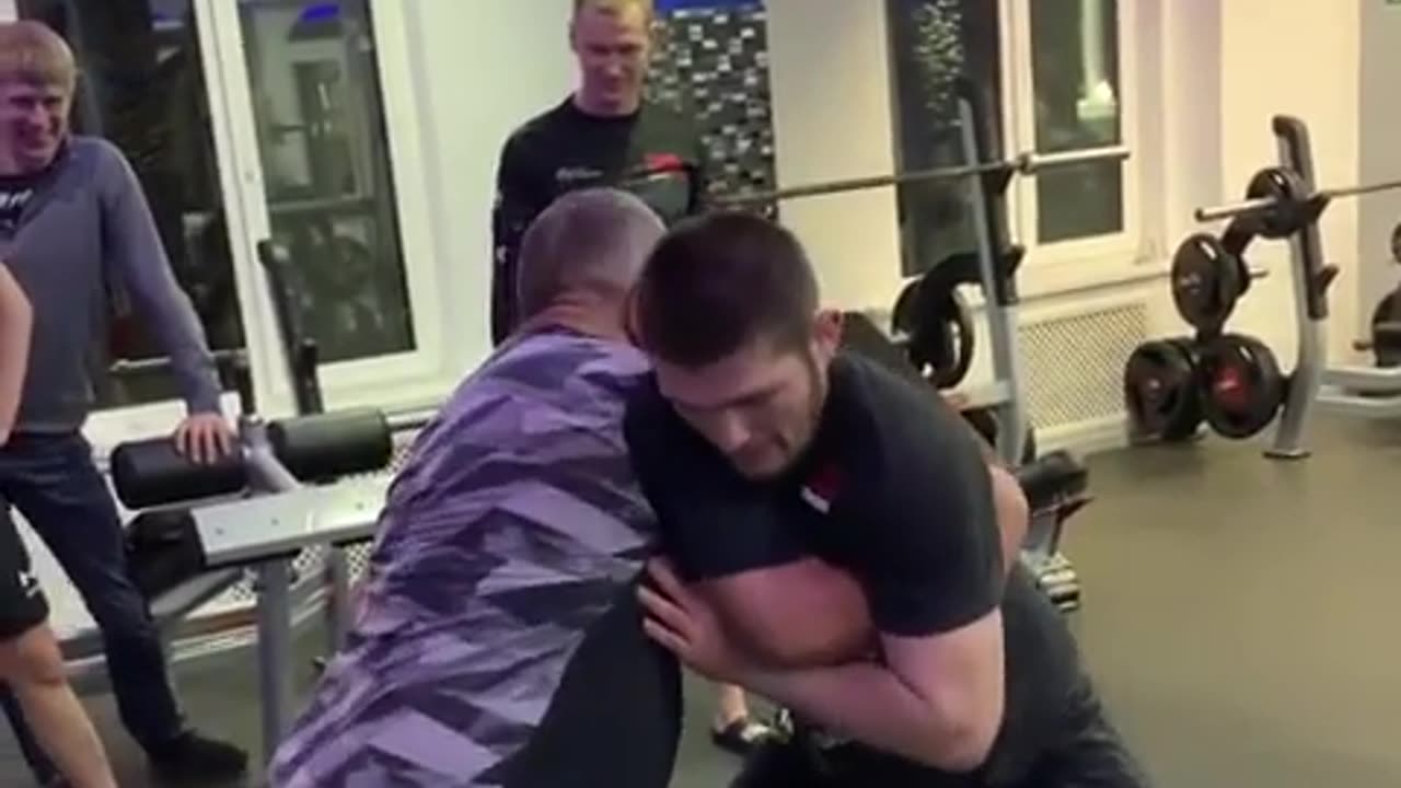 Khabib grappling with his father