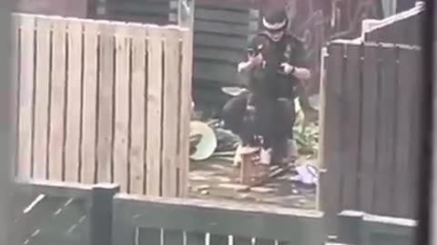 ENGLAND MANCHESTER - COP ENJOYS A ROCKING HORSE WHILE ON DUTY