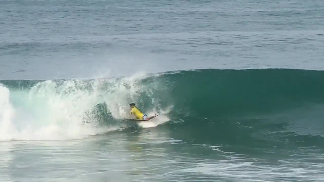 Surfer wave breakwater ocean sea