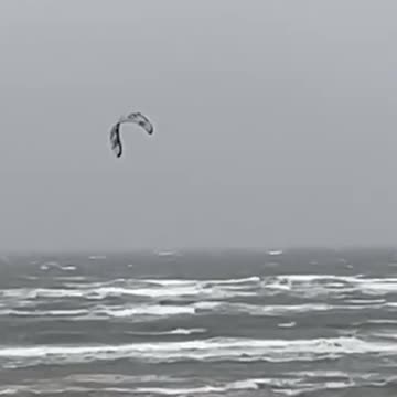 Storm Bert: Person does some EXTREME wind surfing on turbulent waves