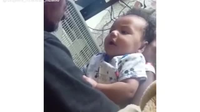 Toddler saying I love you to his dad