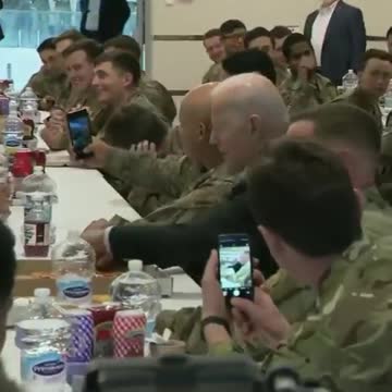 Pres. Biden eats pizza with service members in Rzeszow, Poland