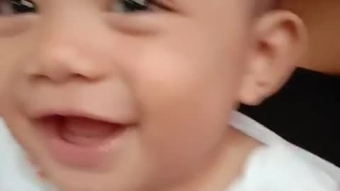 A baby can't stop laughing