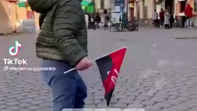 Ukrainian child singing a song to the memory of Nazi