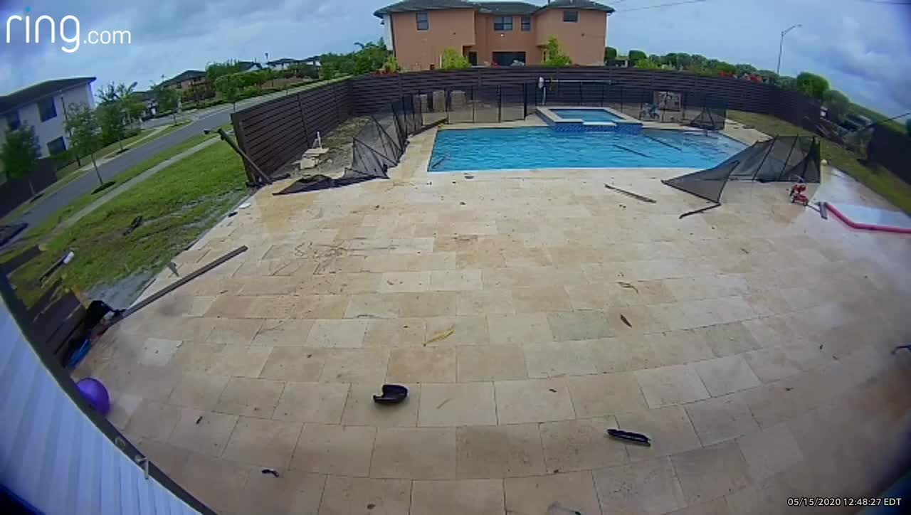 Car Slams Through Fences and Skims Across Pool