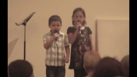 Young Boy Can’t Stop Laughing As He Duets With His Sister In Church