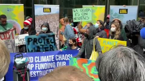 Young climate activists hold protest in front of Standard Chartered Bank in London