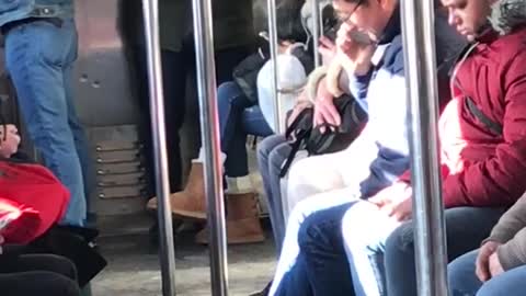 Man dances on subway full of sleepy people