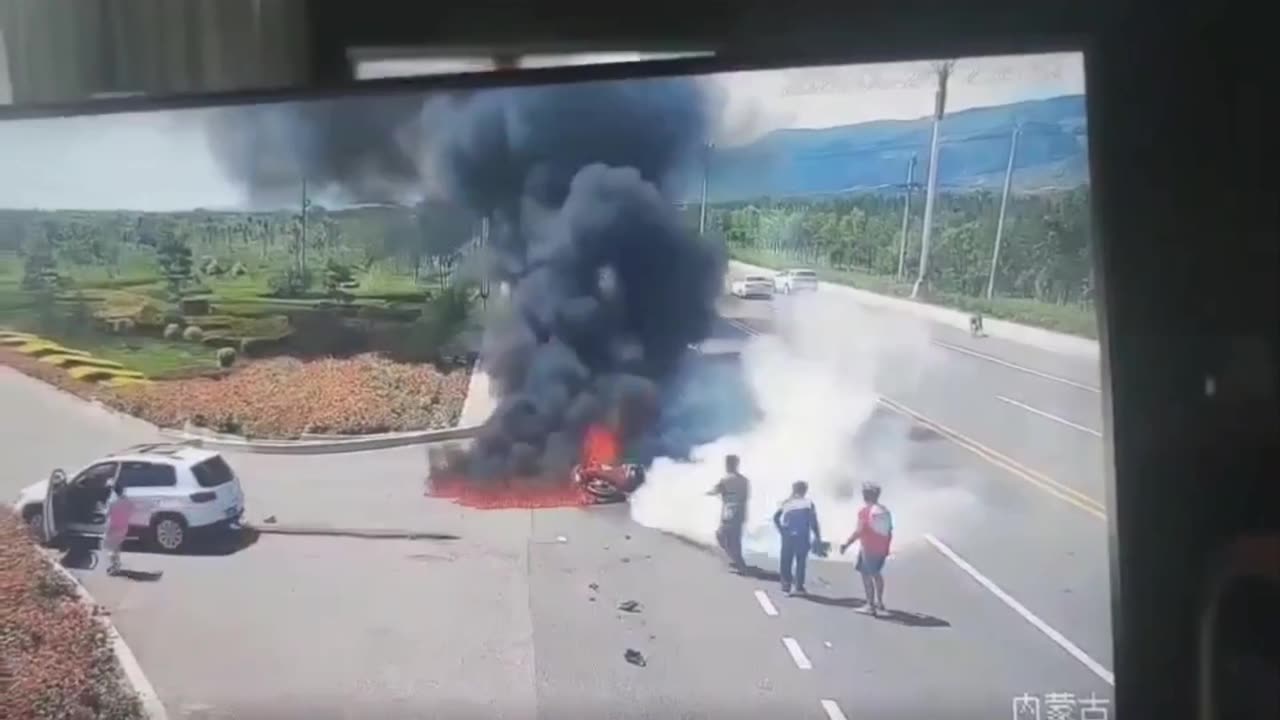 Hohhot, Inner Mongolia, China. Biker crash & burns on the highway